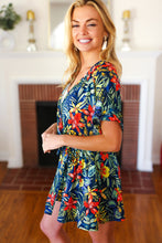 Load image into Gallery viewer, Navy Tropical Floral Surplice Romper