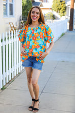 Load image into Gallery viewer, Vacay Ready Blue &amp; Orange Floral Frill Mock Neck Top
